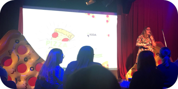 Pizza for losers speaker Julia Ammon delivers her talk: The communication Passport Project that never travelled and what it taught me about project funding.